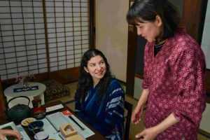 A guest participating in a Japanese breakfast-making experience at a temple stay